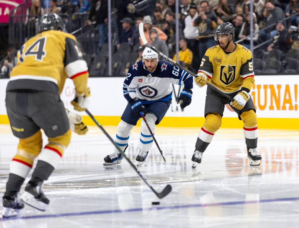 Winnipeg Jets right wing Nino Niederreiter (62) and Golden Knights right wing Keegan Kolesar (5 ...