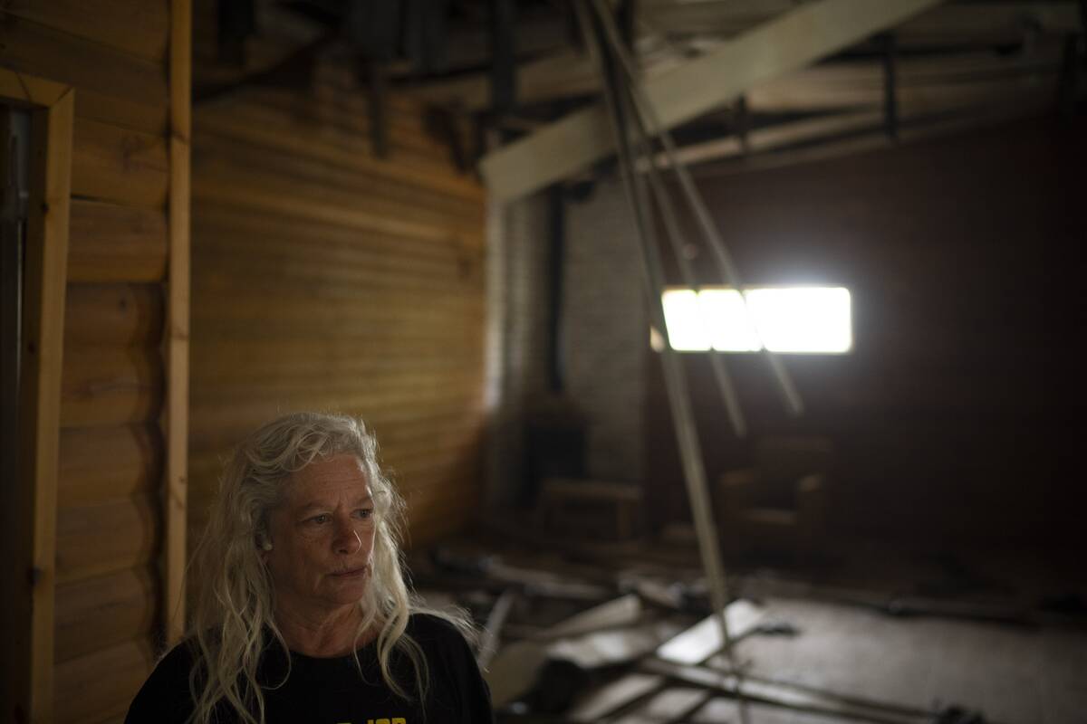 CORRECTS SURNAME.- Orna Weinberg stands at the damaged dining hall, that was hit by a rocket fi ...