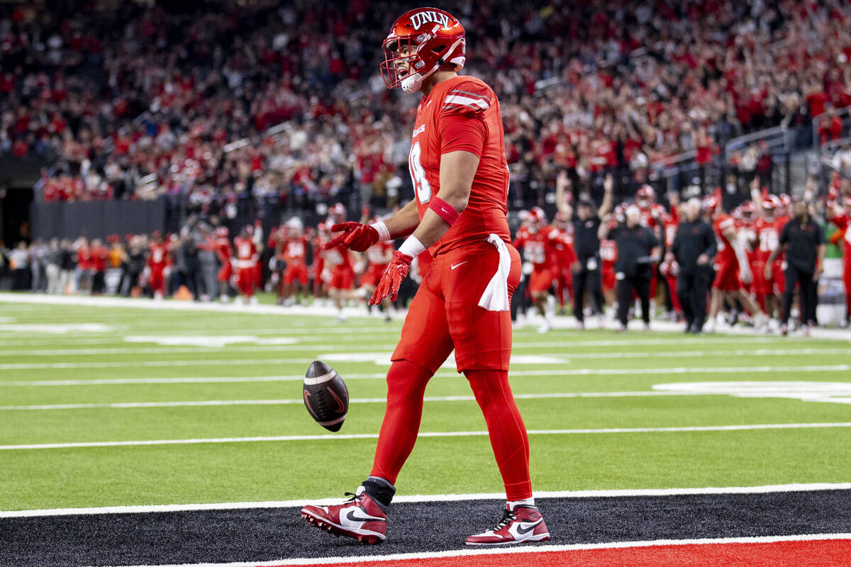 UNLV tight end Kaleo Ballungay (19) celebrates after scoring a touchdown during the NCAA colleg ...