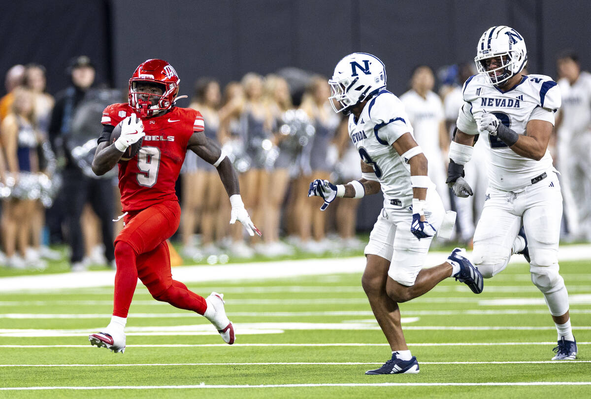 UNLV running back Jai'Den Thomas (9) runs with the ball during the NCAA college football game a ...