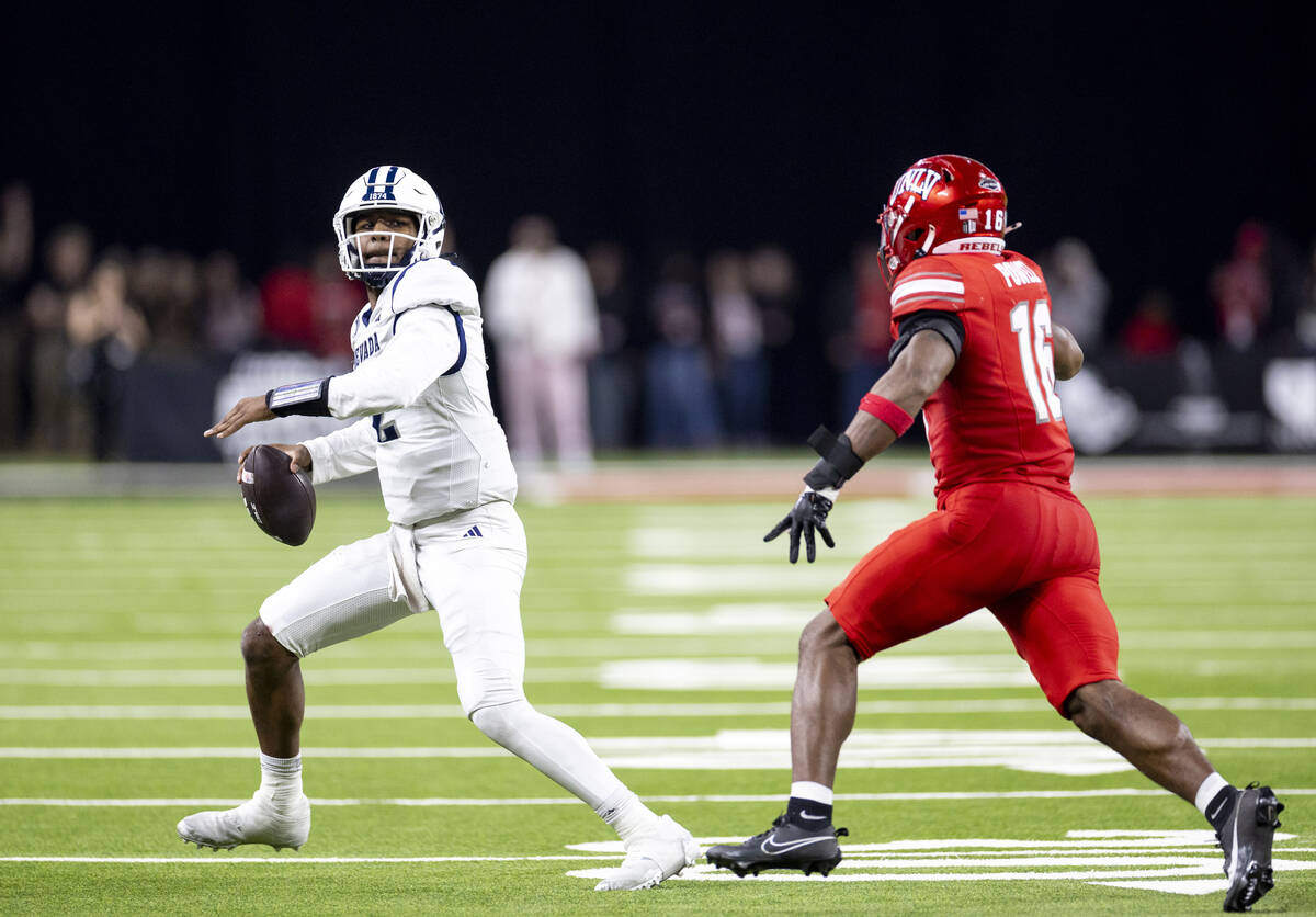 UNR quarterback Brendon Lewis (2) looks to throw the ball during the NCAA college football game ...