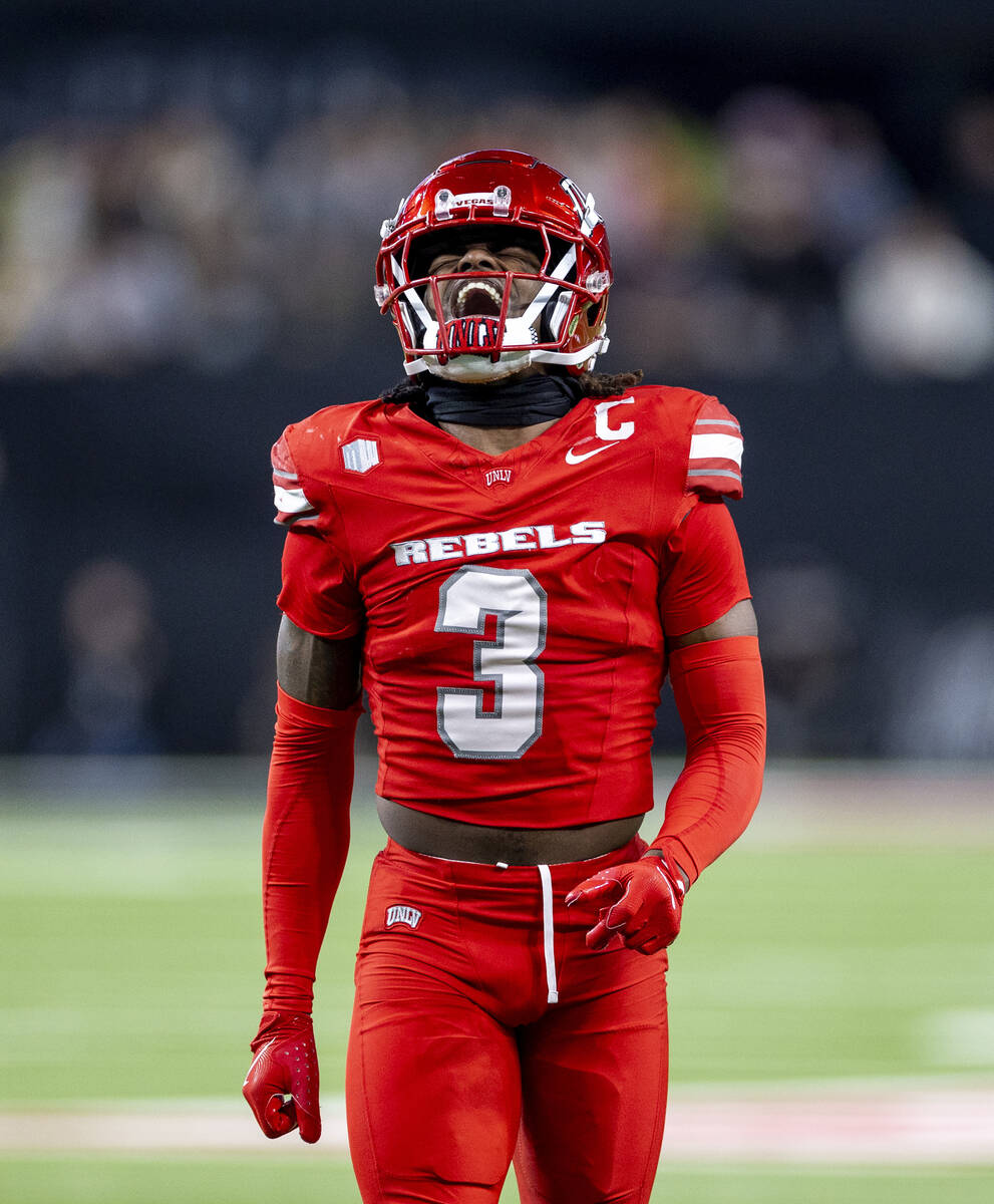 UNLV defensive back Johnathan Baldwin (3) winces while walking after a play during the NCAA col ...