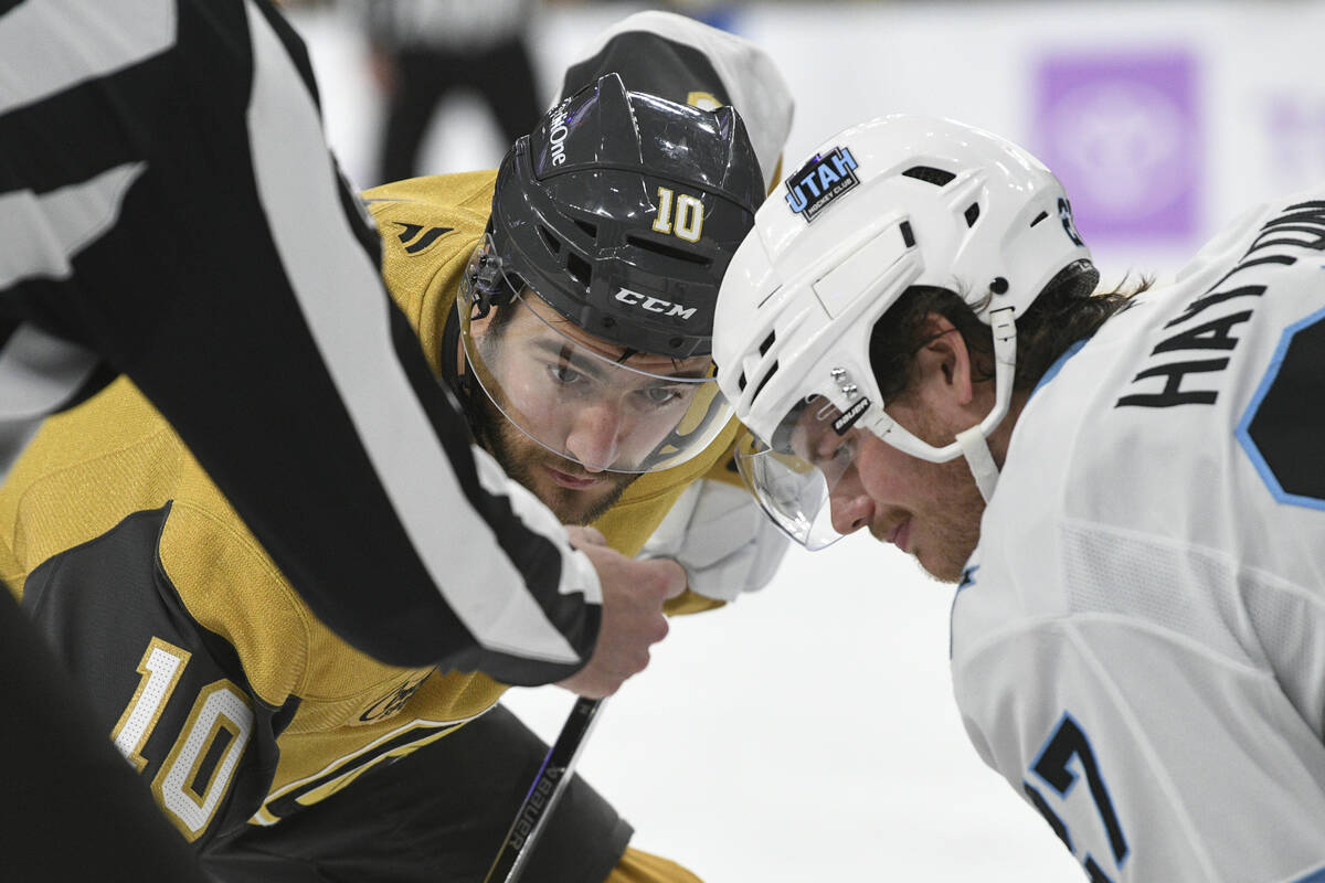 Vegas Golden Knights center Nicolas Roy (10) and Utah Hockey Club center Barrett Hayton, right, ...