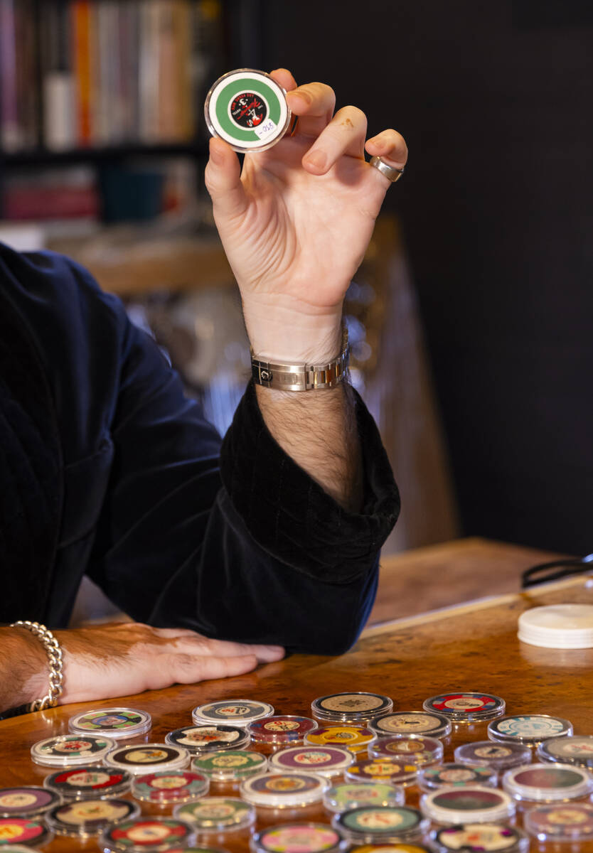 Ralph DeLuca, an art advisor and collector, shows off some of his Las Vegas casino chip collect ...