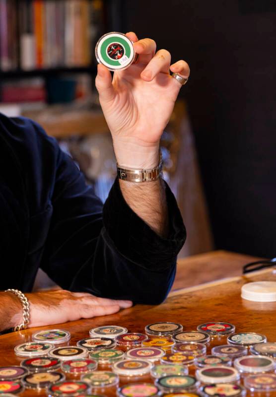 Ralph DeLuca, an art advisor and collector, shows off some of his Las Vegas casino chip collect ...