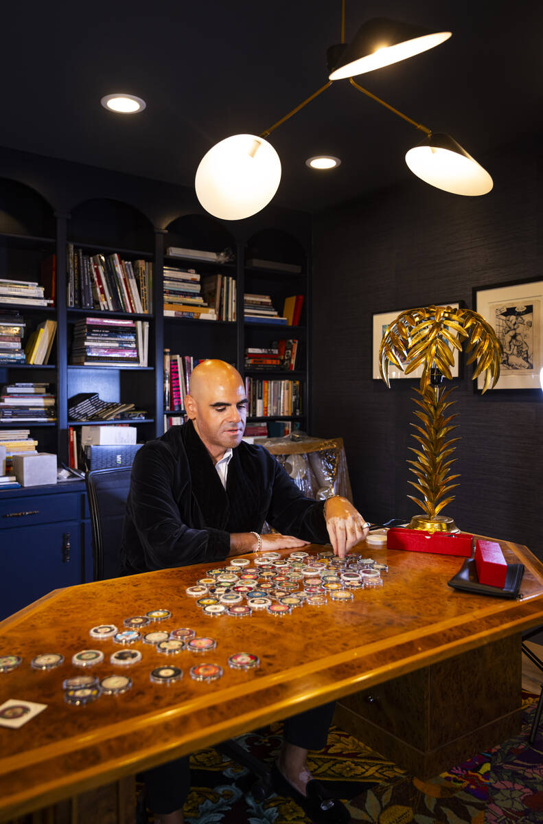 Ralph DeLuca, an art advisor and collector, looks through some of his Las Vegas casino chip col ...