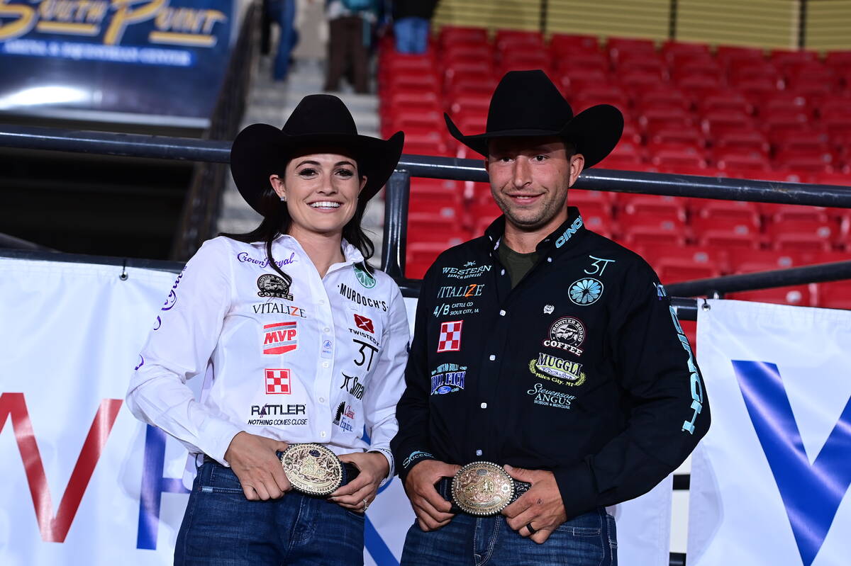 Shelby Boisjoli-Meged and her husband, Haven Meged, show off their world champion belt buckles. ...