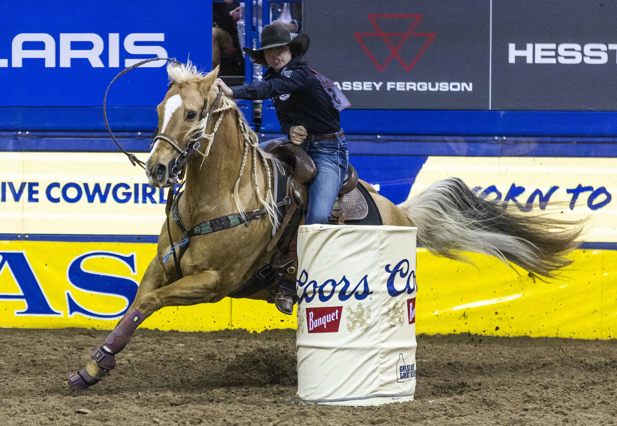 Hailey Kinsel of Cotulla, Texas., navigates a barrel on the way to her winning time in Barrel R ...