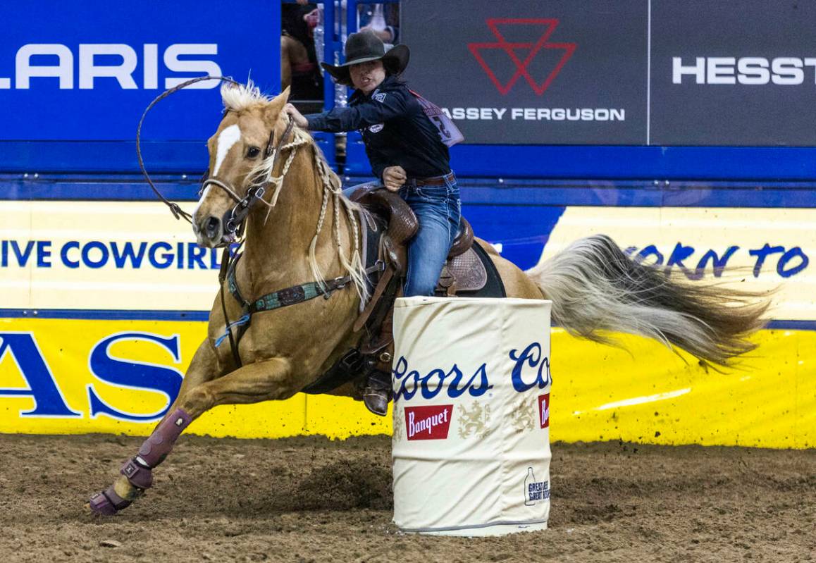 Hailey Kinsel of Cotulla, Texas., navigates a barrel on the way to her winning time in Barrel R ...