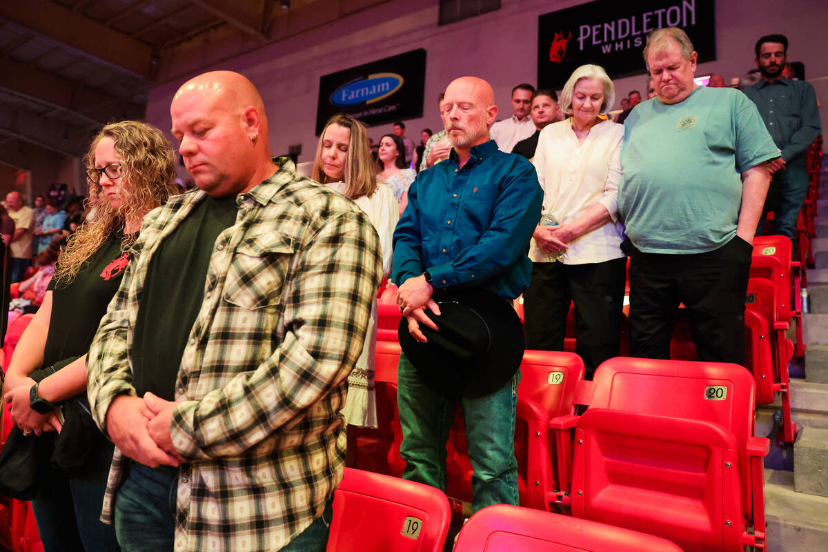 Rodeo fans bow their heads in prayer during The Run For A Million competition at the South Poin ...