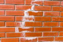 Efflorescence can be seen in many places, such as on block walls where it appears as white stai ...