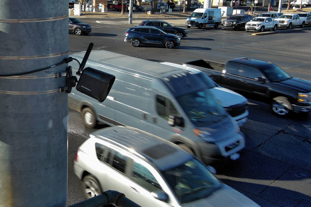 A license plate camera scans traffic at the intersection of Sunset Road and Marks Street in Hen ...