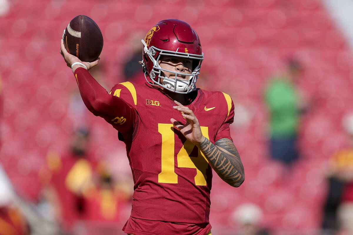 Southern California quarterback Jayden Maiava warms up before an NCAA college football game aga ...