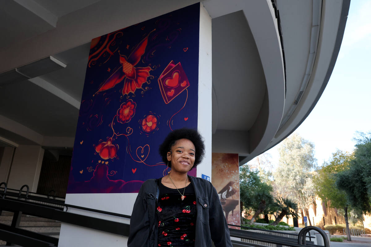 UNLV theater arts major Kennedy Jackson poses with her mural outside Beam Hall on the UNLV camp ...