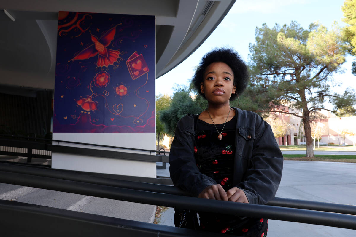 UNLV theater arts major Kennedy Jackson poses with her mural outside Beam Hall on the UNLV camp ...