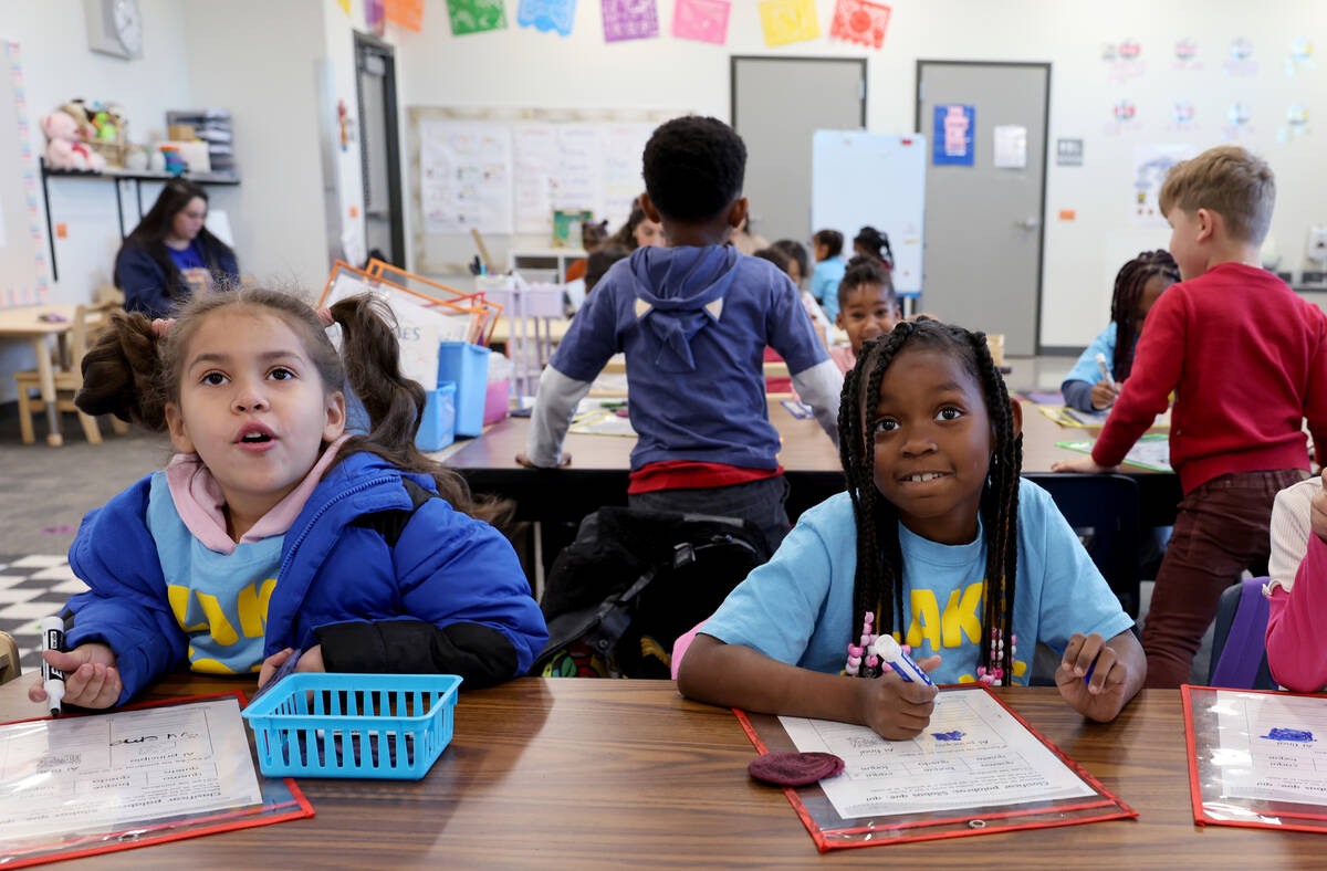 Samantha Leyva De La Vega, left, and Za’Kariya-Henderson work in the classroom of Kinder ...