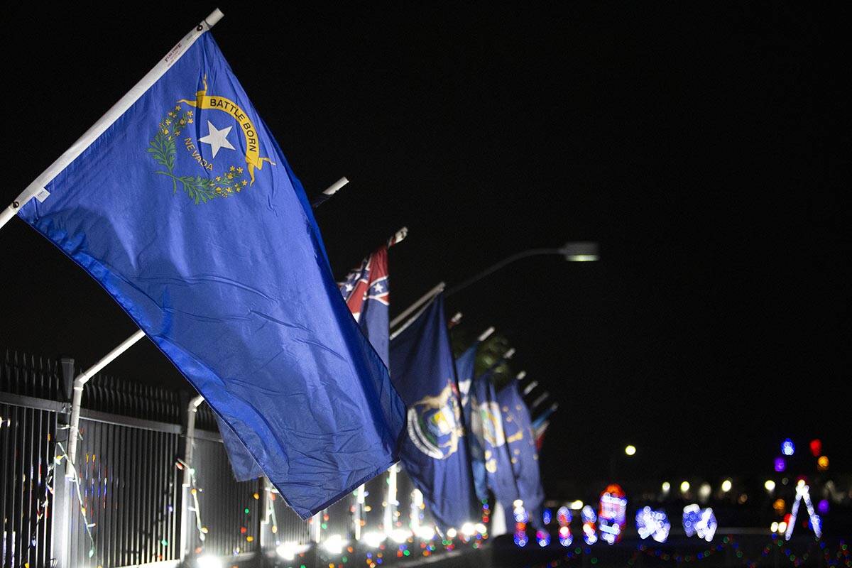 The Nevada state flag sits in a row of all of the flags of the 50 states at Glittering Lights o ...