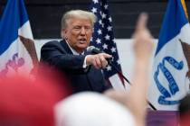 Donald Trump visits with campaign volunteers. (AP Photo/Charlie Neibergall)