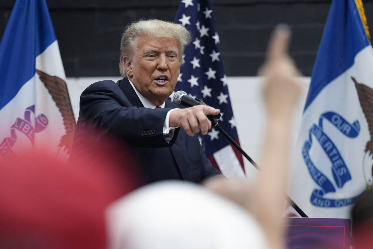 Donald Trump visits with campaign volunteers. (AP Photo/Charlie Neibergall)