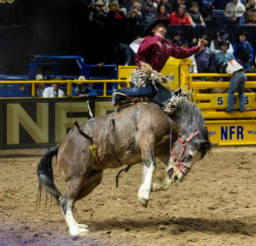 Damian Brennan catches some air in Saddle Bronc Riding during day 6 action of the NFR at the Th ...