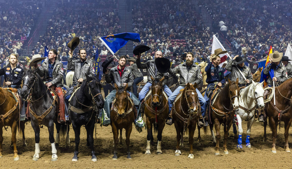 Competitors tip their hats to the fans after being introduced during the final day action of th ...