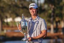 Maverick McNealy holds the trophy after the final round of the RSM Classic golf tournament, Sun ...