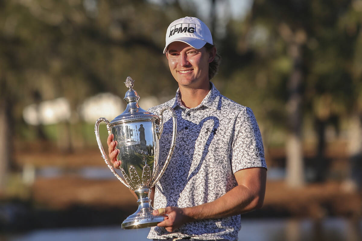 Maverick McNealy holds the trophy after the final round of the RSM Classic golf tournament, Sun ...