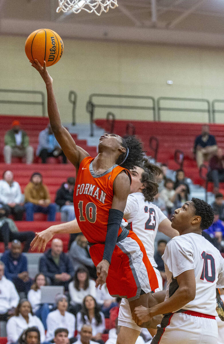 Bishop Gorman guard Nick Jefferson (10) gets inside for a shot over Arbor View guard Trammell D ...