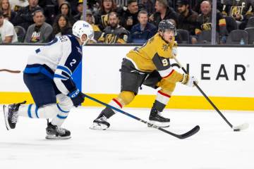 Golden Knights center Jack Eichel (9) controls the puck during the third period of the NHL hock ...