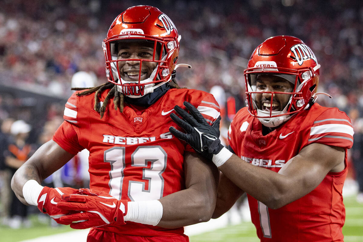 UNLV defensive back Jarvis Ware (13) and defensive back Jalen Catalon (1) celebrate a play duri ...