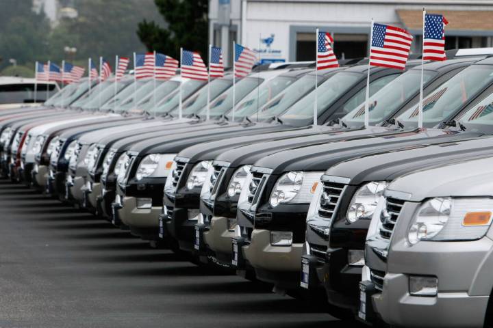 A row of new Ford trucks are displayed on display at a Ford dealership Sept. 4, 2007, in Colma, ...