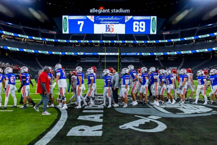 Bishop Gorman players greet Arbor View players following their 69-7 win for another Class 5A Di ...