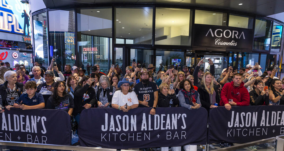 Fans look on as Jason Aldean and the TC Restaurant Group celebrate the grand opening of Jason A ...