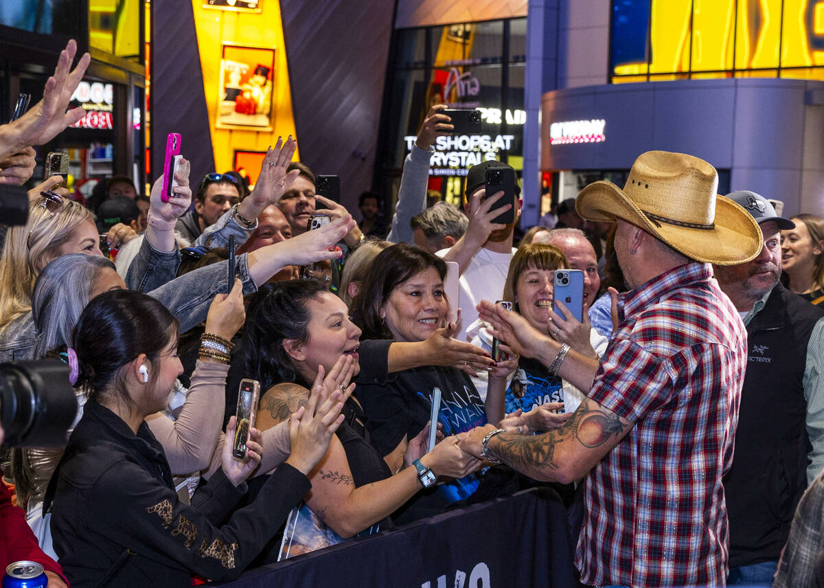 Jason Aldean takes time out to greet fans as he and the TC Restaurant Group celebrate the grand ...