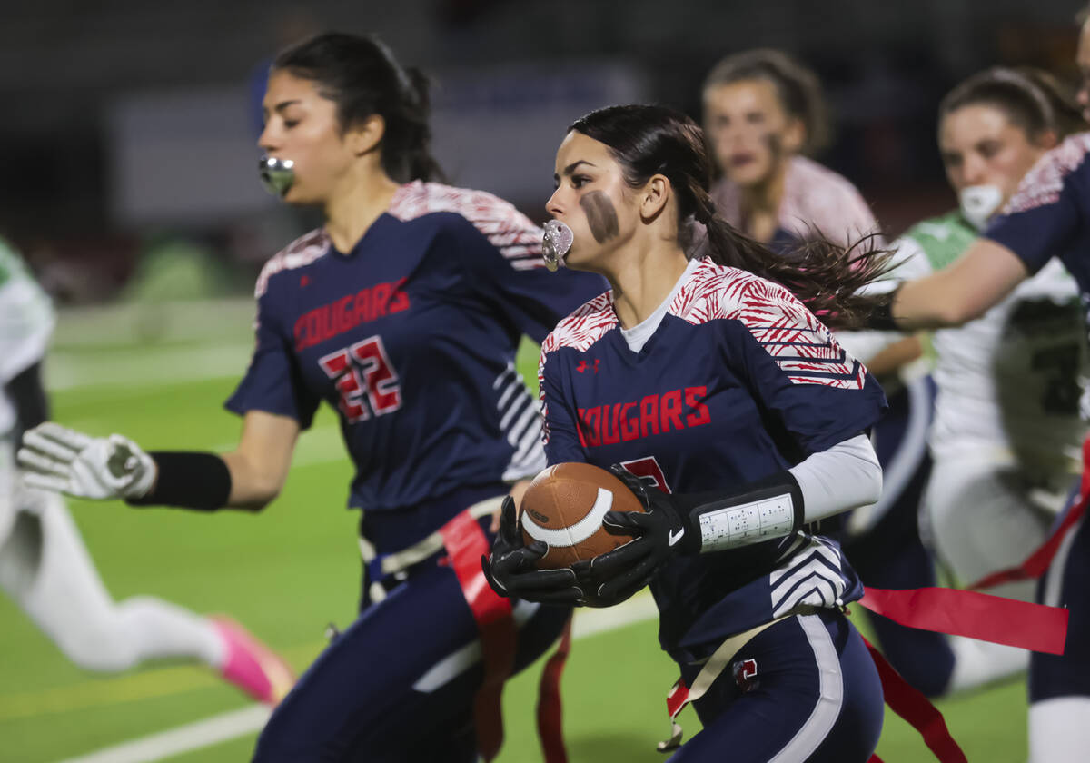 Coronado's Maddy Aguilar (2) runs the ball against Green Valley during a flag football game at ...