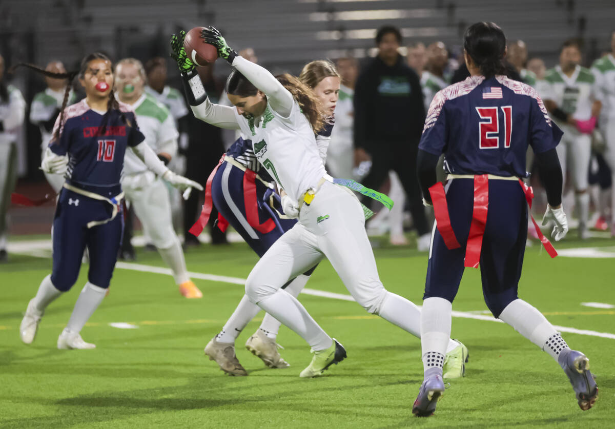 Green Valley's Lyla Baxter (7) gets stopped by Coronado during a flag football game at Coronado ...