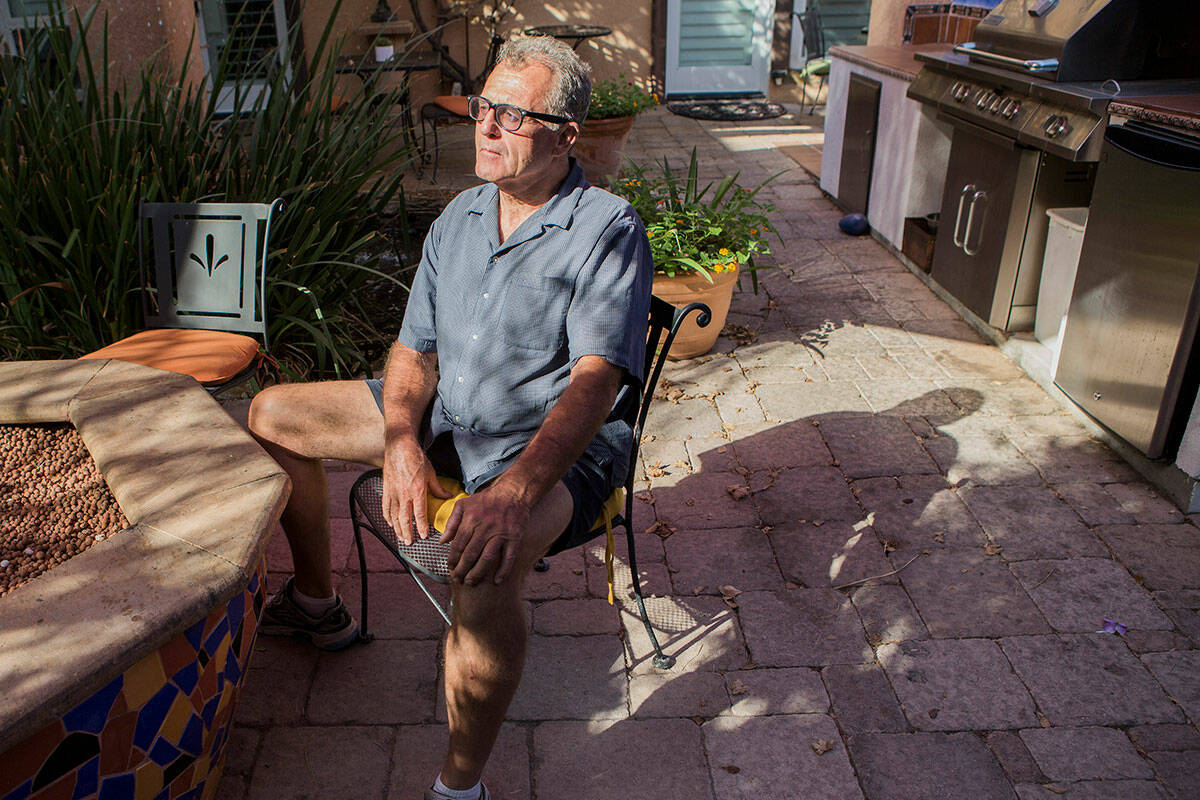 Milo Hurst, owner of Milo's Cellar & Wine, 538 Nevada Way, sits in the courtyard on July 25, 20 ...