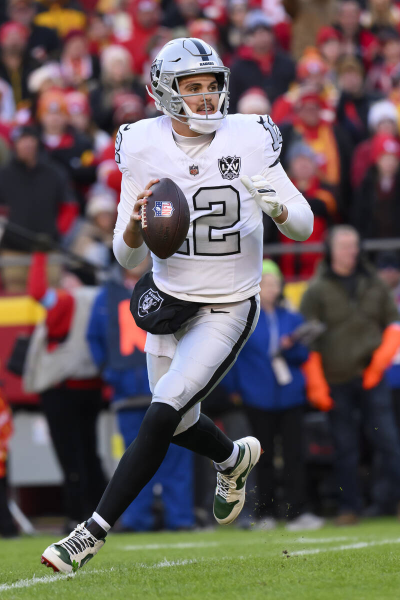 Las Vegas Raiders quarterback Aidan O'Connell rolls out to pass against the Kansas City Chiefs ...