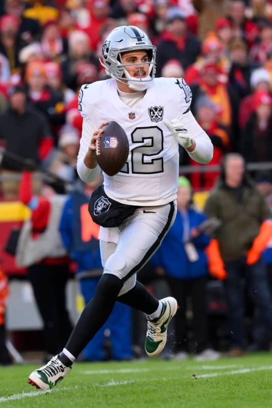 Las Vegas Raiders quarterback Aidan O'Connell rolls out to pass against the Kansas City Chiefs ...