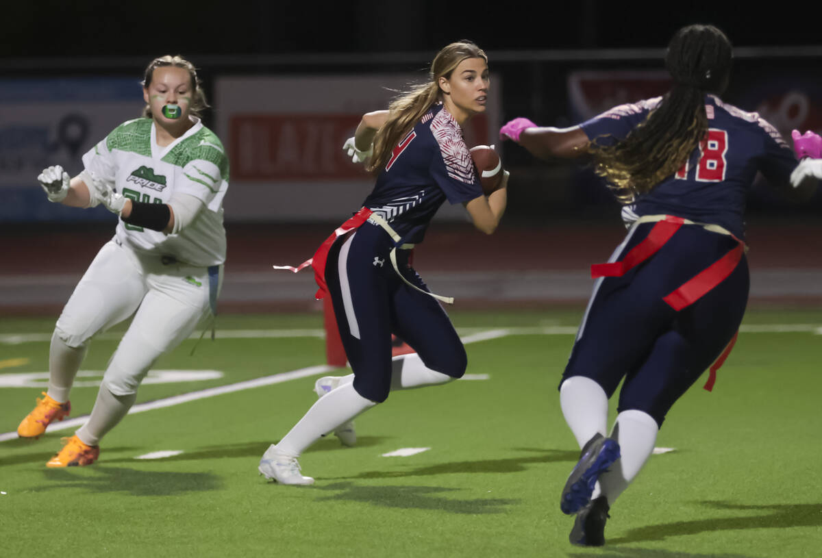 Coronado's Lauren Wood runs the ball after intercepting it from Green Valley during a flag foot ...