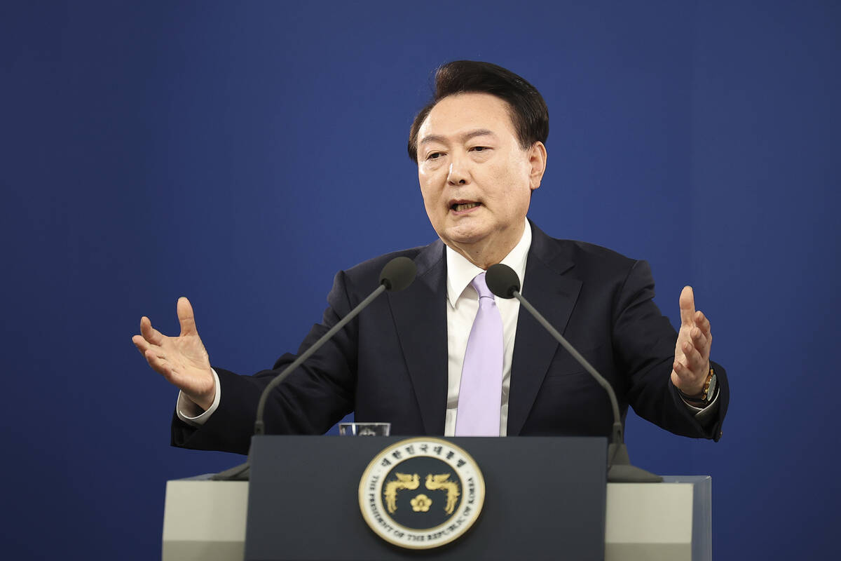 FILE - South Korean President Yoon Suk Yeol answers a reporter's question during a news confere ...