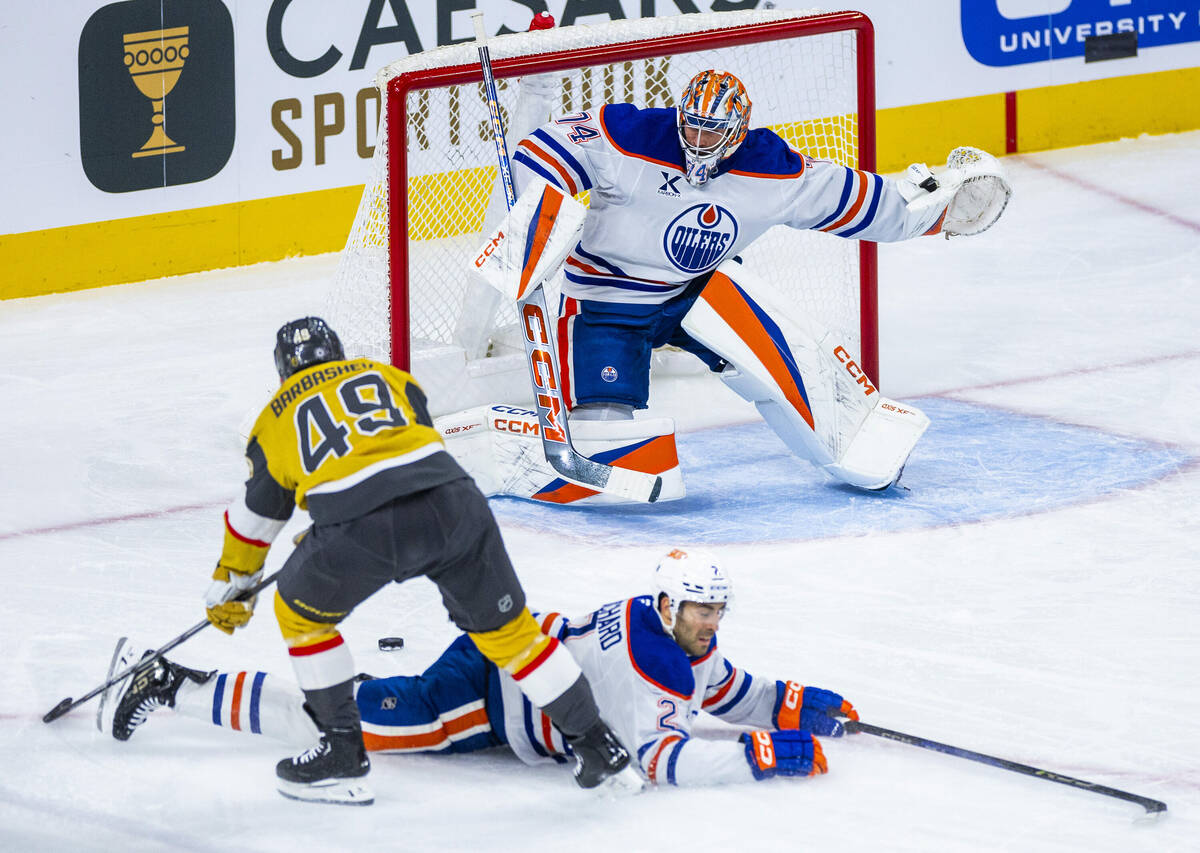 Golden Knights center Ivan Barbashev (49) gets a rebound shot off of Edmonton Oilers defenseman ...