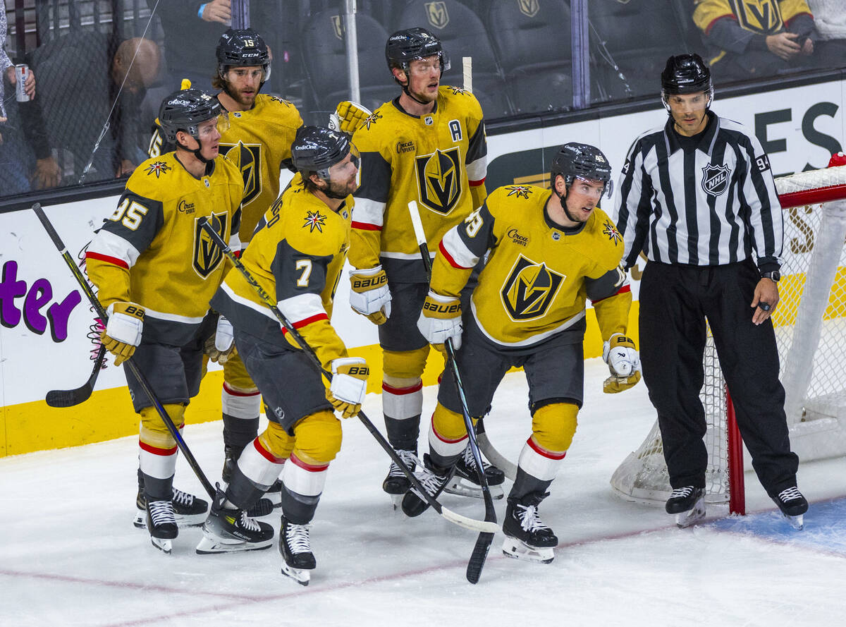 Golden Knights center Ivan Barbashev (49) and teammates celebrate his goal against Edmonton Oil ...