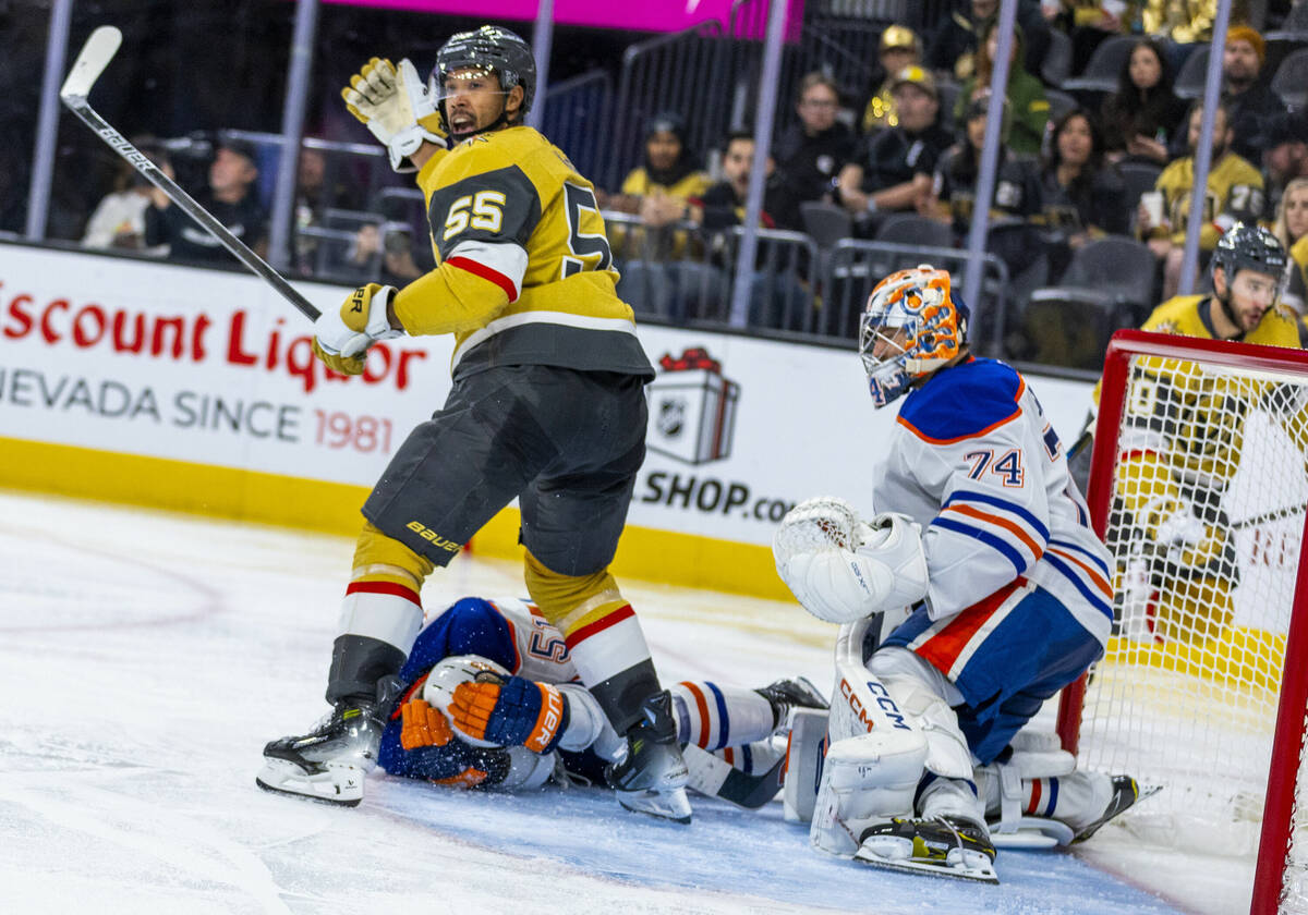 Golden Knights right wing Keegan Kolesar (55) calls for medical assistance as Edmonton Oilers d ...