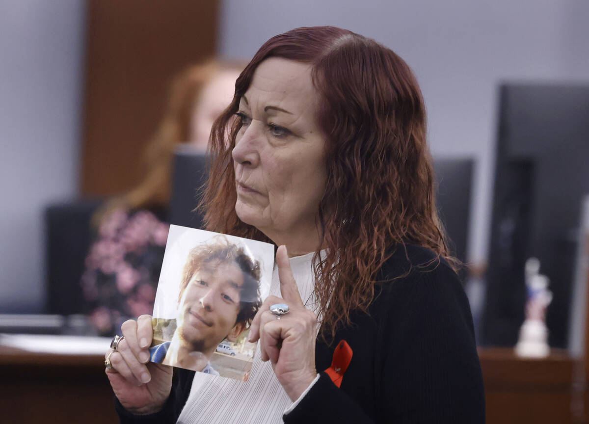 Christie Moody holds a photography of her nephew Timothy Bailey before delivering her victim im ...