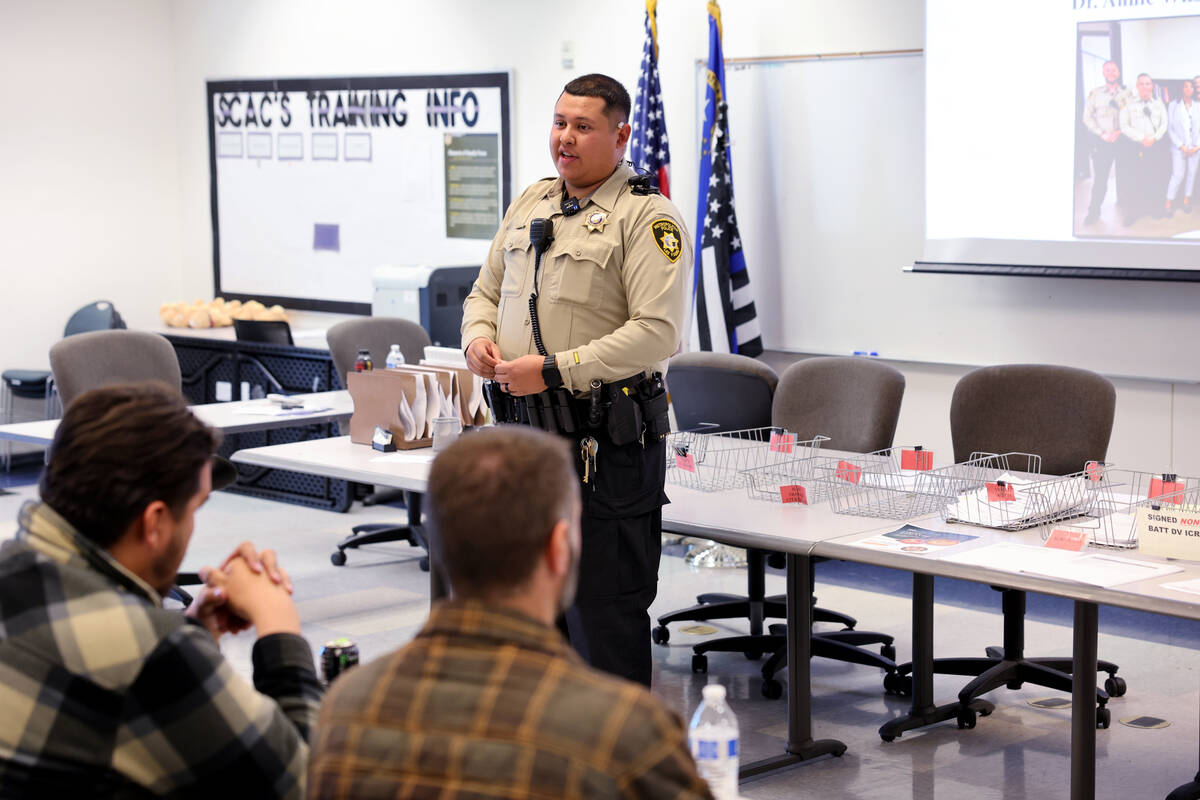 Las Vegas police officer Lio Garcia talks about homeless outreach resources during the Metropol ...