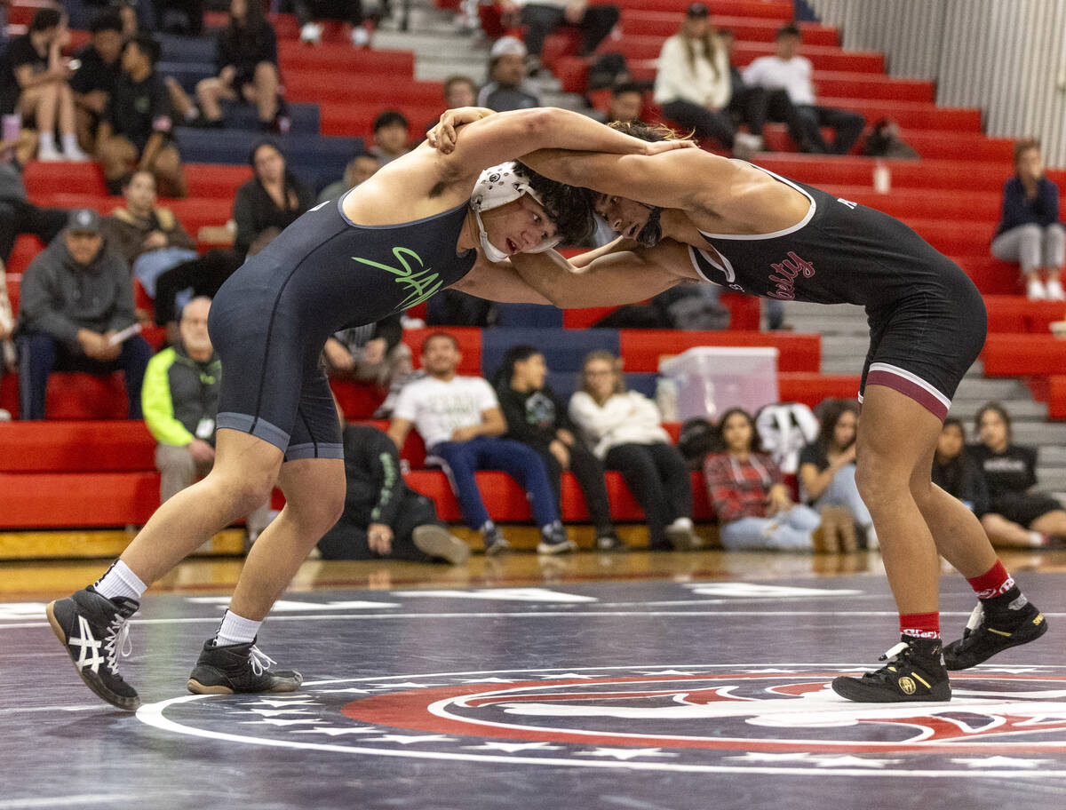 SLAM Academy’s Anthony Delgado, left, and Liberty’s Zayne Omaya, right, compete d ...