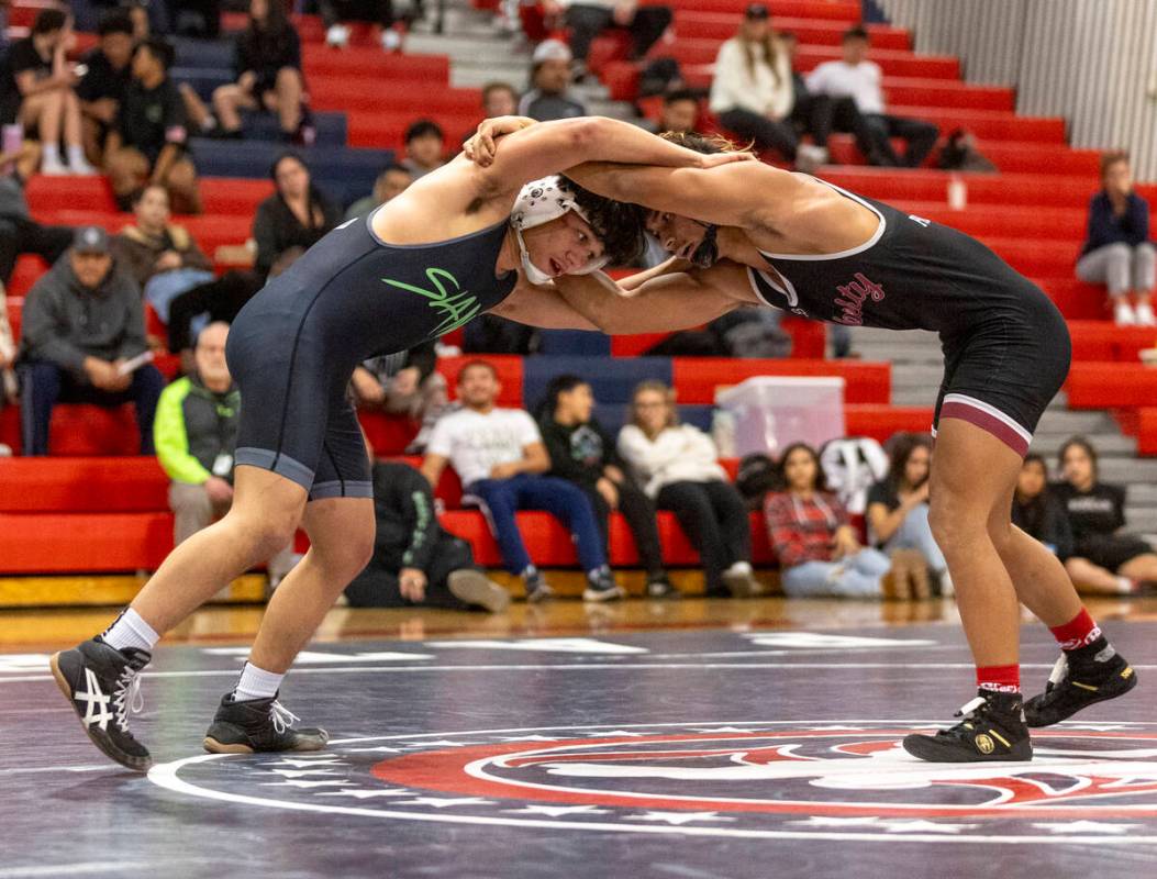 SLAM Academy’s Anthony Delgado, left, and Liberty’s Zayne Omaya, right, compete d ...