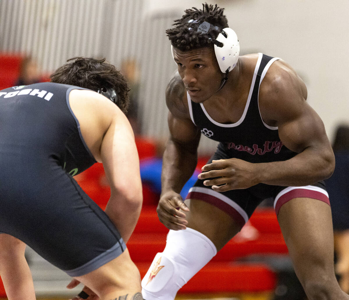 Liberty’s Melvin Whitehead, right, competes against SLAM Academy’s Satoshi Davis, ...