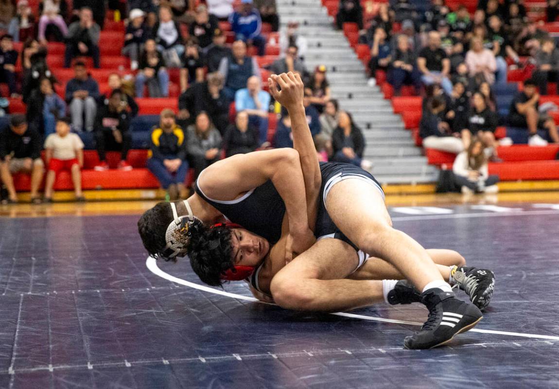 SLAM Academy’s Santiago Cabrera, top, and Liberty’s Alan Hayes, bottom, compete d ...